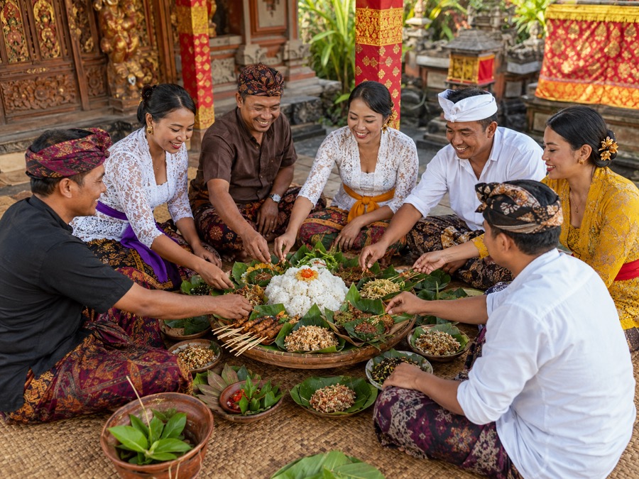 People sharing a Megibung-style communal meal in Karangasem